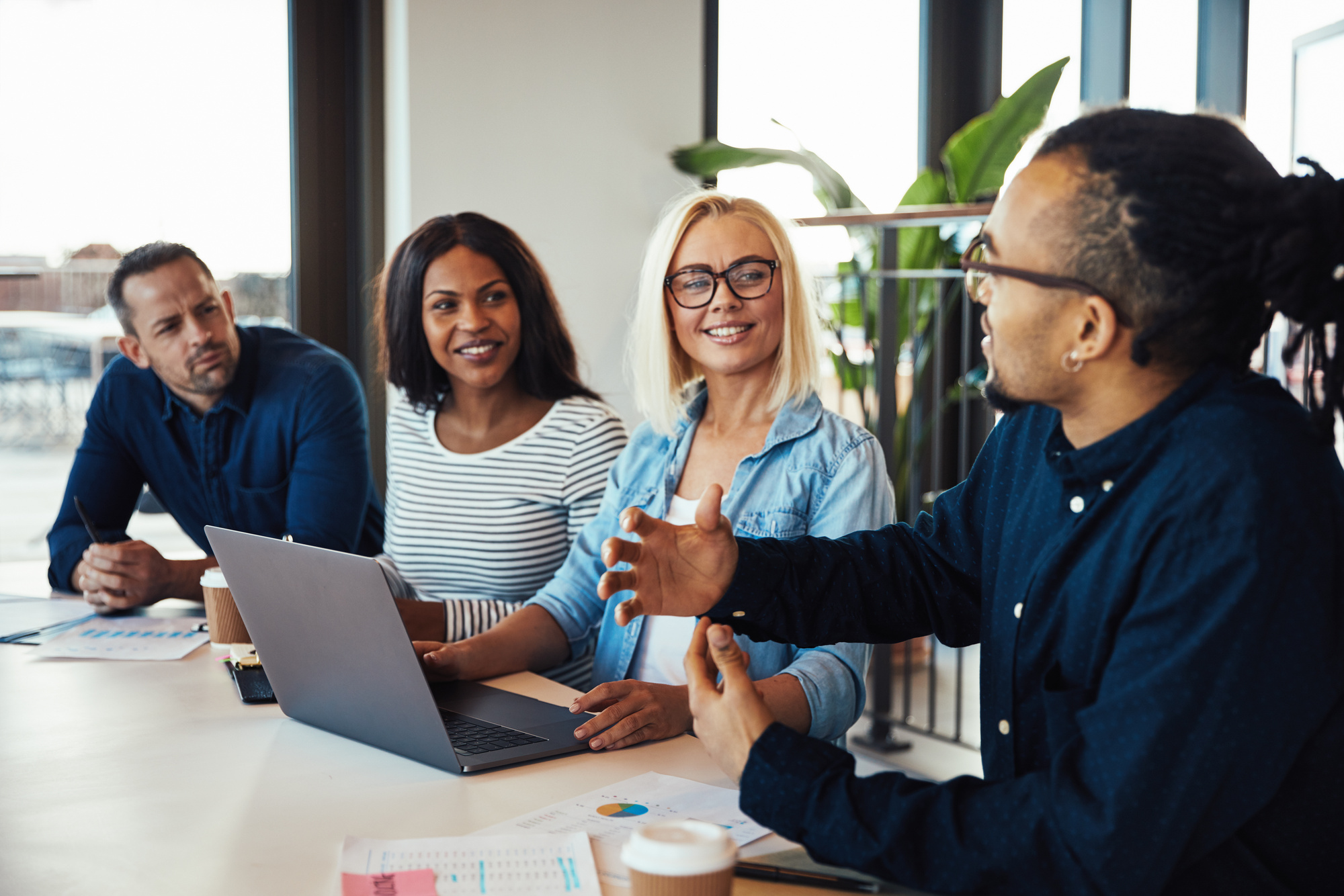 Young African American Businessman Discussing Work with Smiling