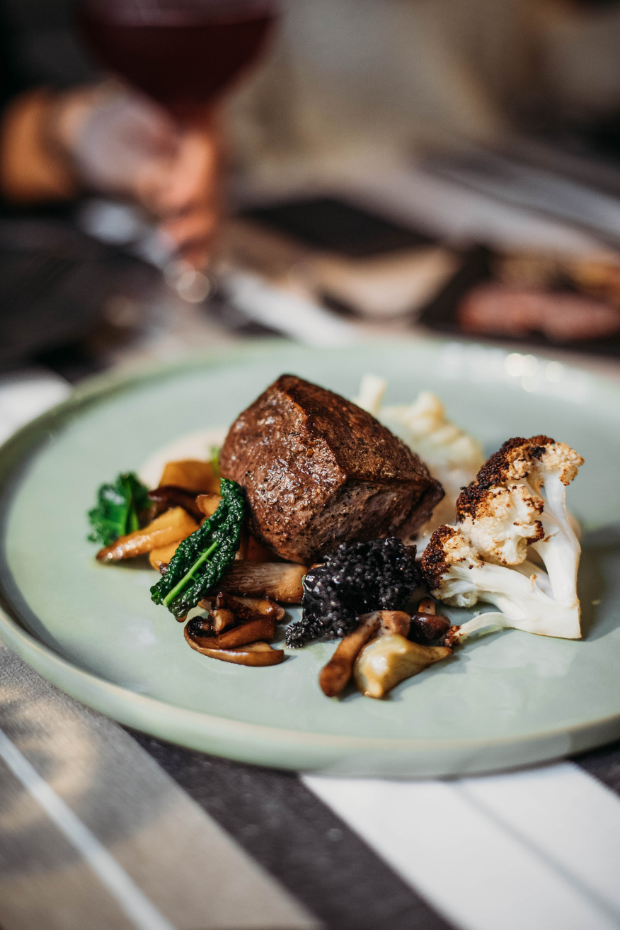 Steak served with grilled cauliflower