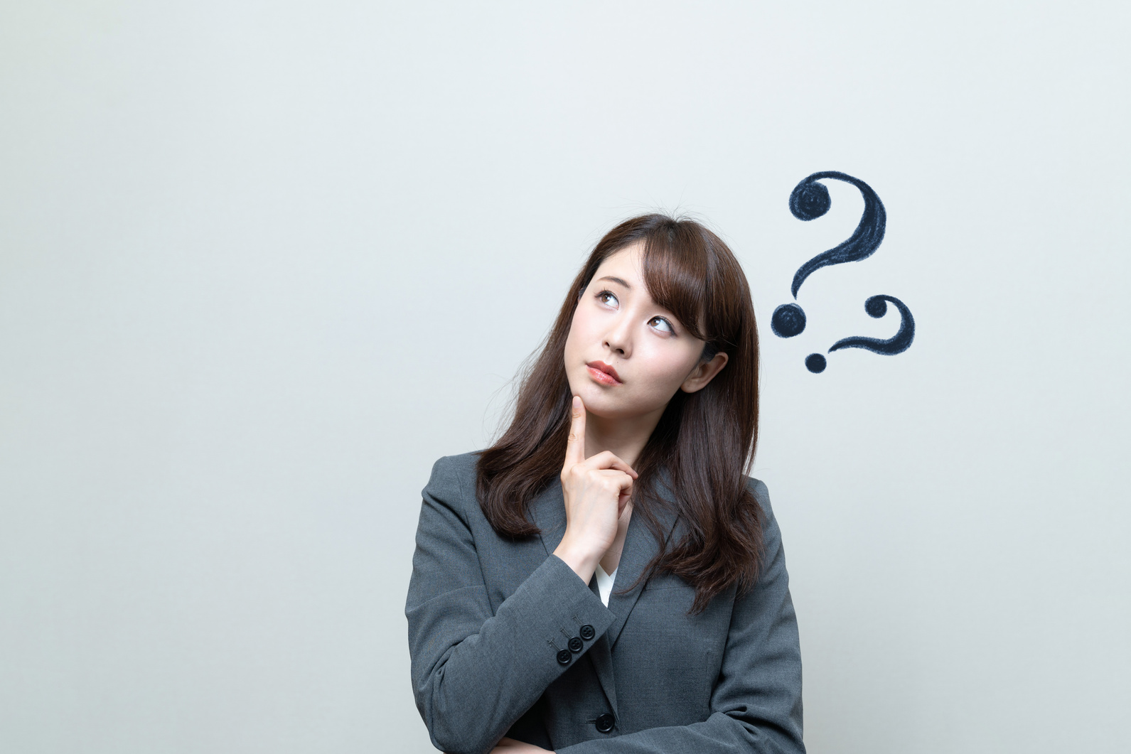 Woman Thinking with Question Marks Above Her Head 